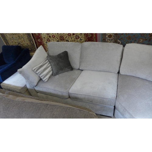 1552 - An Aluminium upholstered corner sofa with black oak feet RRP £3995