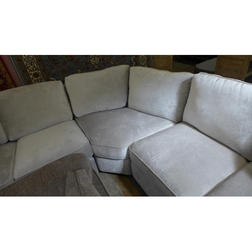 1552 - An Aluminium upholstered corner sofa with black oak feet RRP £3995