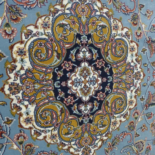 1554 - A fine woven Persian duck egg blue field with floral medallion design, 200x300cm