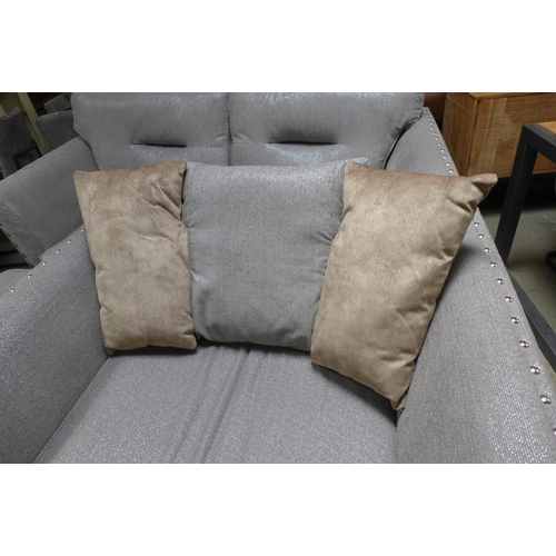 1611 - A Coco four seater sofa, love seat and footstool