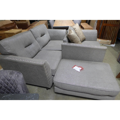 1611 - A Coco four seater sofa, love seat and footstool