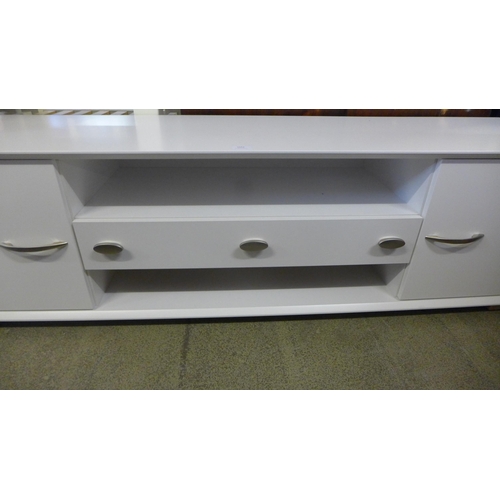 1653 - A white two door, one drawer TV/media unit