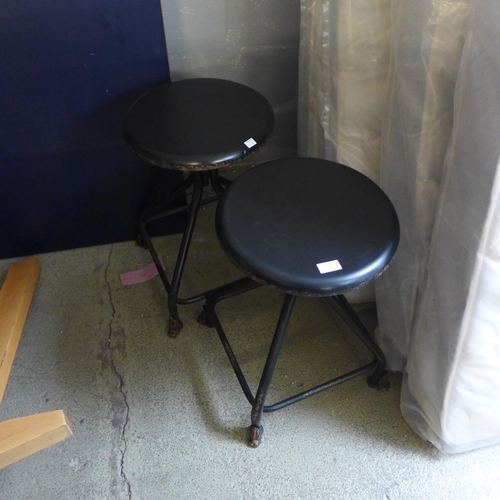 1713 - A pair of industrial style wind up stools