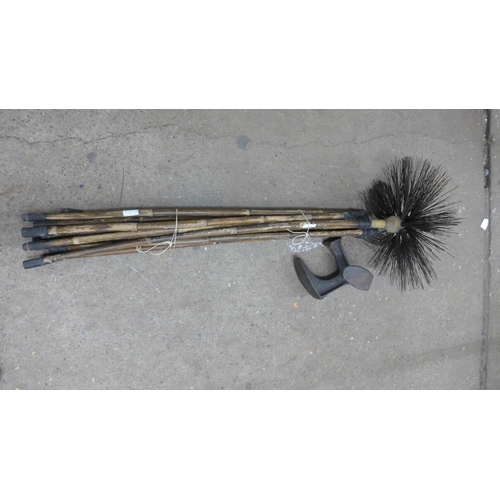 2083 - Pack of chimney rods and a metal Swain shoe dolly