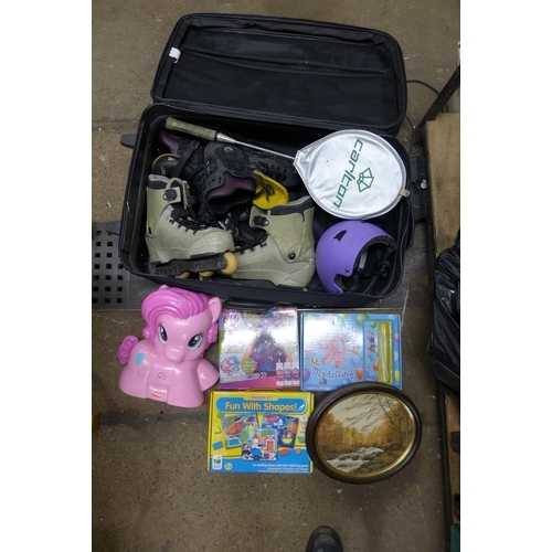 2115 - Suitcase of roller boots and headgear, large quantity of toys and games