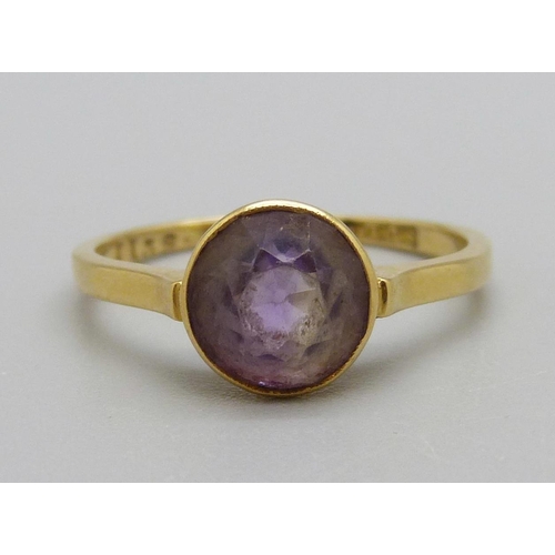 1121 - A yellow metal and amethyst ring, 2.2g, N, mark worn