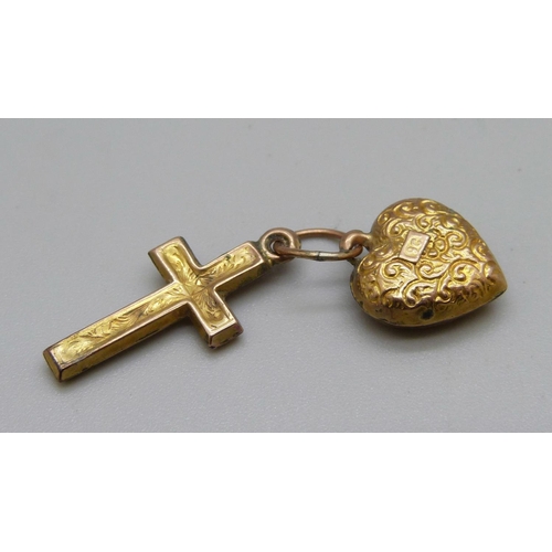 1122 - A 9ct gold heart charm and a cross, 1.3g total weight