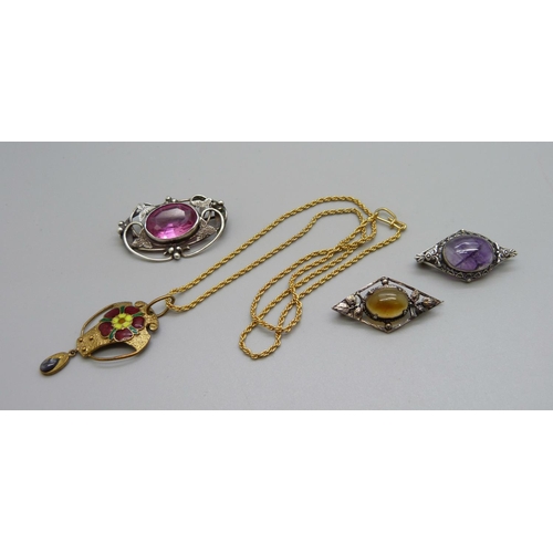 1125 - Three Arts and Crafts brooches and an enamel pendant