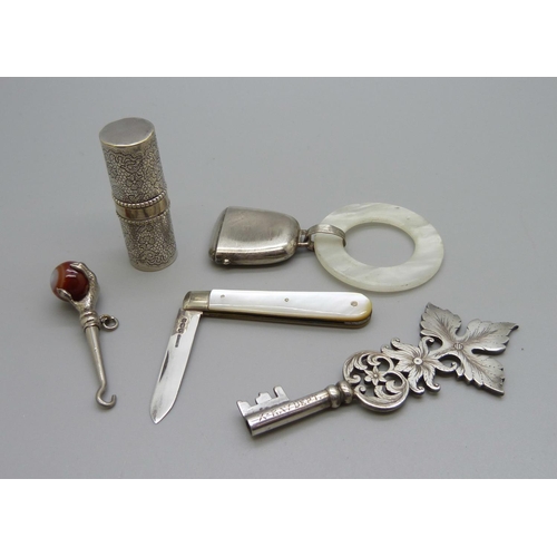 1128 - An 'X-Ray Department' white metal key, a Marcel Rochas French lipstick case, stamped inside, a silve... 