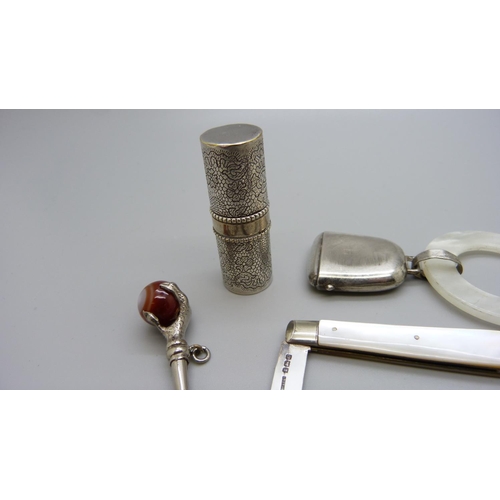 1128 - An 'X-Ray Department' white metal key, a Marcel Rochas French lipstick case, stamped inside, a silve... 