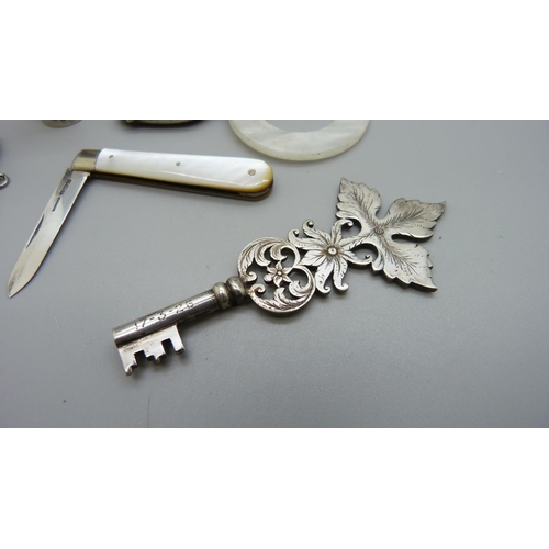 1128 - An 'X-Ray Department' white metal key, a Marcel Rochas French lipstick case, stamped inside, a silve... 