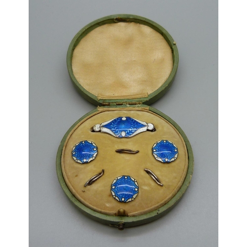 1129 - A cased silver and enamel brooch and button set, Birmingham 1911, enamel on brooch a/f