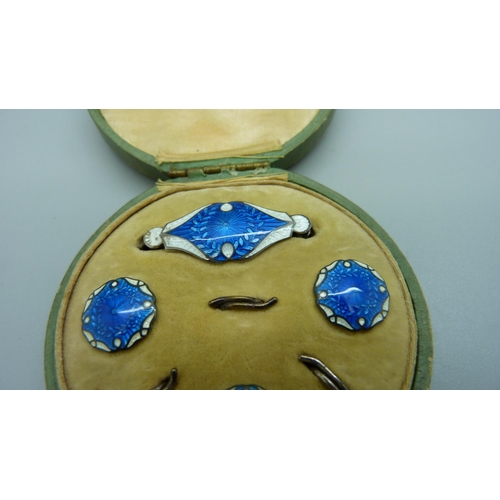 1129 - A cased silver and enamel brooch and button set, Birmingham 1911, enamel on brooch a/f