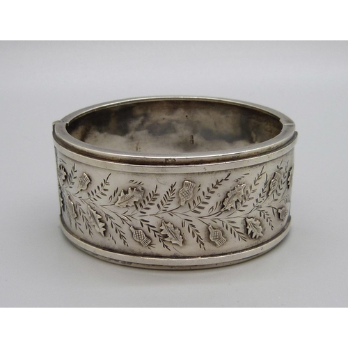 1130 - A Victorian silver bangle, fastener a/f and dented