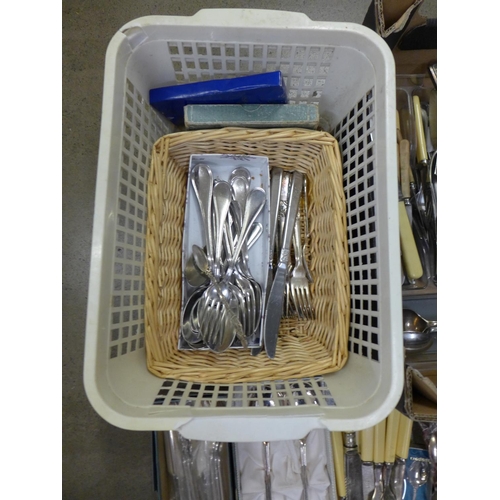 1141 - A large box of plated and stainless steel cutlery **PLEASE NOTE THIS LOT IS NOT ELIGIBLE FOR POSTING... 