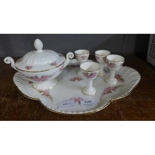 1142 - A continental floral pattern meat plate, four egg cups and sugar bowl **PLEASE NOTE THIS LOT IS NOT ... 