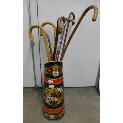 1156 - A bargeware fireside coal scuttle and a collection of walking sticks **PLEASE NOTE THIS LOT IS NOT E... 