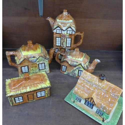 662 - A Price Kensington Cottage ware tea service and two butter dishes