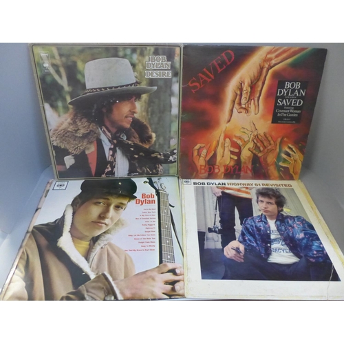 672 - A collection of eleven Bob Dylan LP records (three gatefold) and three Woody Guthrie LP records