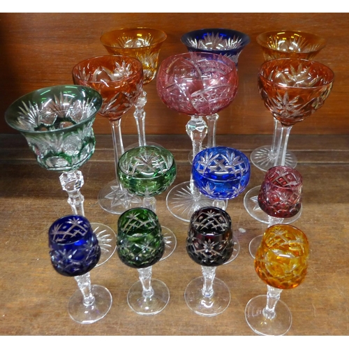 673 - Fourteen Bohemian liqueur and hock glasses with fine detailing on multi-coloured bowls with clear gl... 