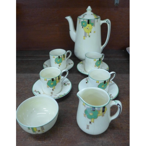 674 - A Homeleigh Ware coffee set, Mayfair, reg. mark 779736, four cups, saucers, cream and sugar, cream j... 