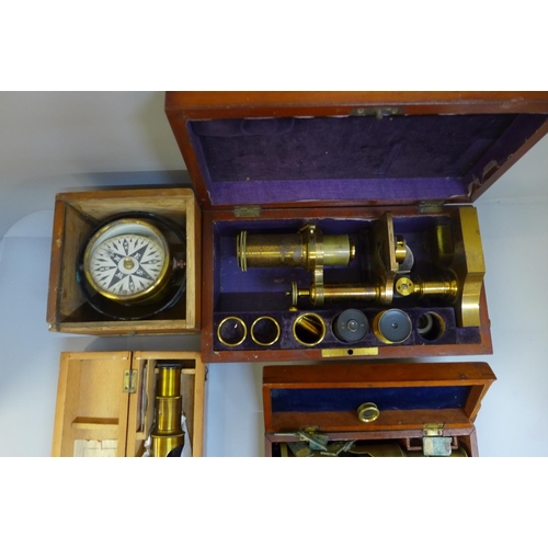 681 - A R&J Beck gilt brass microscope, numbered 8465 with additional eyepieces, two other microscopes and... 