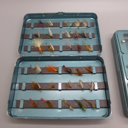 683 - Two tins of approximately seventy vintage trout flies