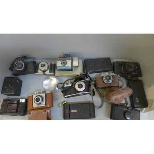 710 - A box of cameras including Olympus and Kodak