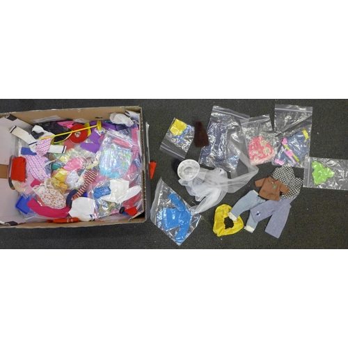 727 - Sindy dolls and a large quantity of clothes