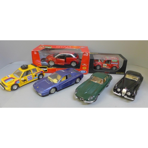 728 - Six model cars; four Burago, one Majorette and one Saico