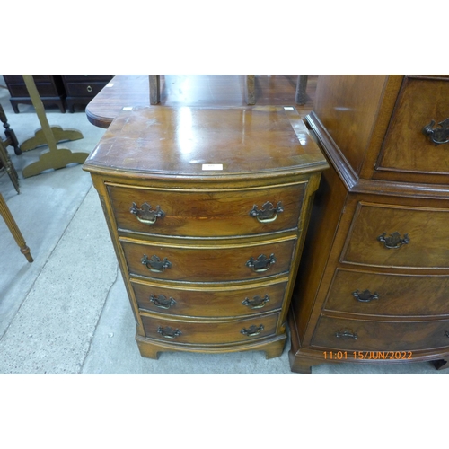 109 - A small yew wood bow chest of drawers