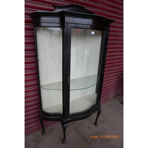 110e - An Edward VII ebonised serpentine display cabinet