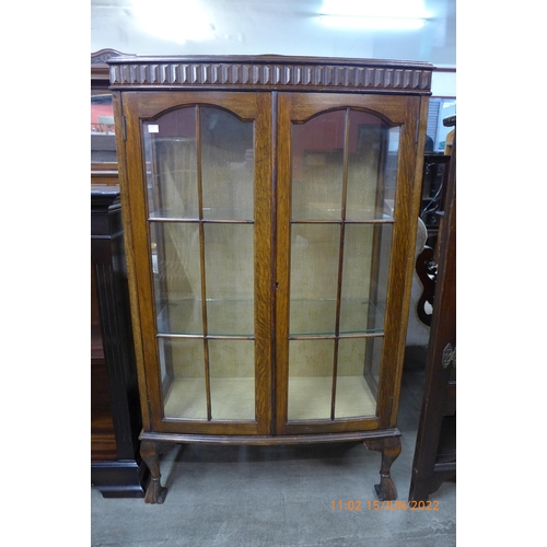 117 - An oak two door display cabinet