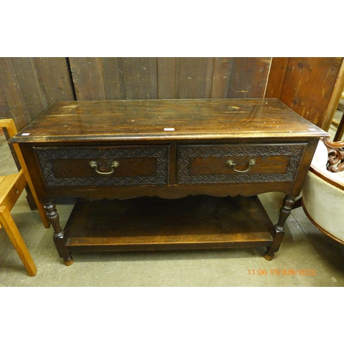 125 - A 17th Century style carved oak two drawer dresser