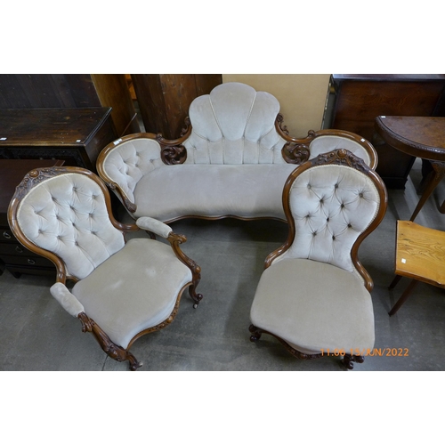 126 - An early Victorian carved walnut and fabric upholstered settee and pair of matching lady's and gentl... 