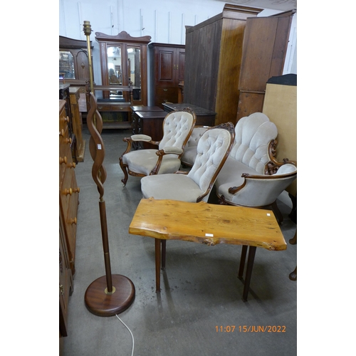 128 - A teak standard lamp and a rootwood coffee table