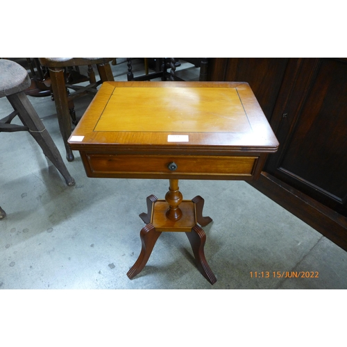 134 - An inlaid yew wood single drawer lamp table