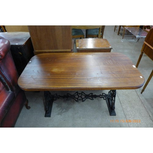 138 - A mahogany and cast iron based pub table