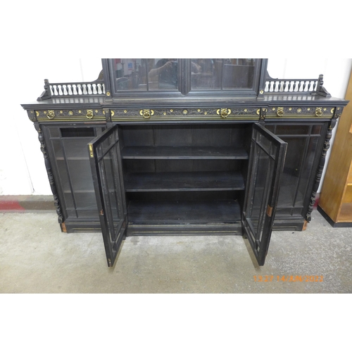 161 - A Victorian Aesthetic Movement ebonised and parcel gilt library bookcase