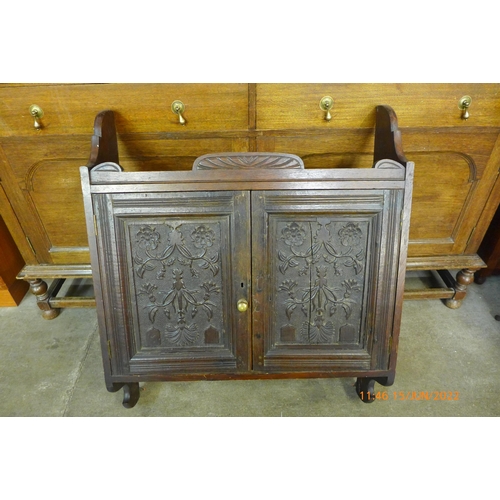 189 - A Victorian Aesthetic Movement carved oak wall hanging cabinet