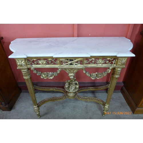 22 - A French Louis XV style carved giltwood and marble topped console table