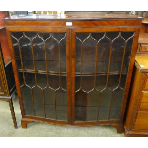 224 - An Edward VII mahogany serpentine bookcase, a/f