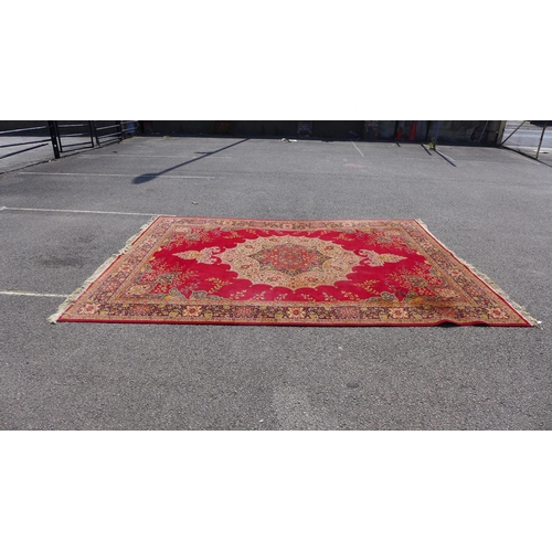 237 - A large red ground rug