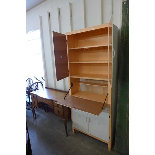 263 - A 1950's painted kitchen cabinet and a walnut dressing table