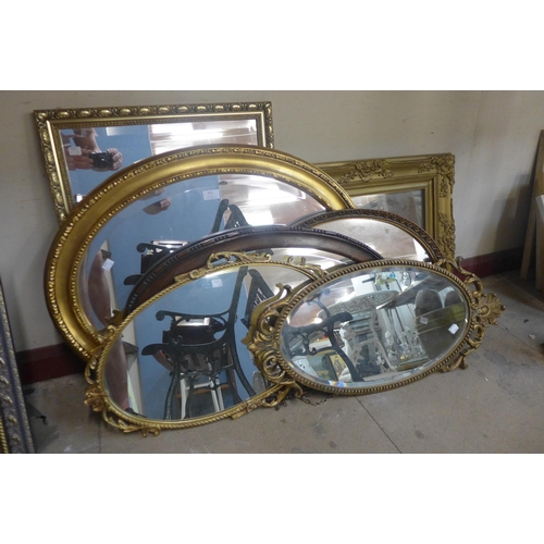 372 - Six gilt framed mirrors and one other