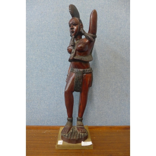 375 - An African carved wood figure of a female