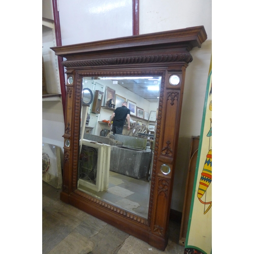 401 - A Victorian style carved walnut overmantel mirror