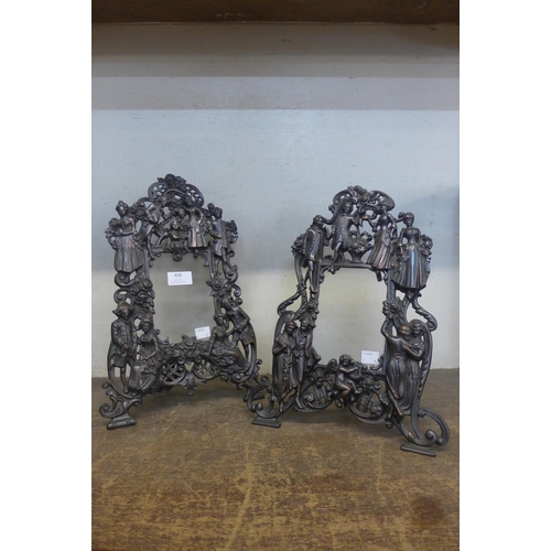 408 - A pair of similar French style cast iron figural strut picture frames