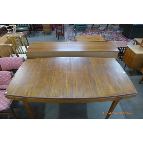 92 - A Danish teak extending dining table