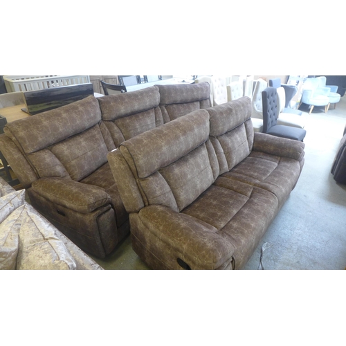 1664 - A Nero rattlesnake green curved power reclining four seater sofa and three seater manual reclining s... 